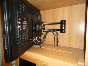 The larger living room TV required a larger mount.  All the cable go to a management system under the TV
