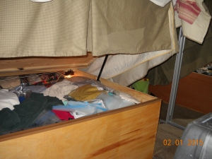This doubles the amount of storage under the bed. Note automatic light in upper right storage area.